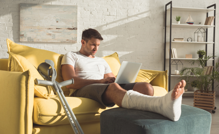 Man on couch with broken ankle